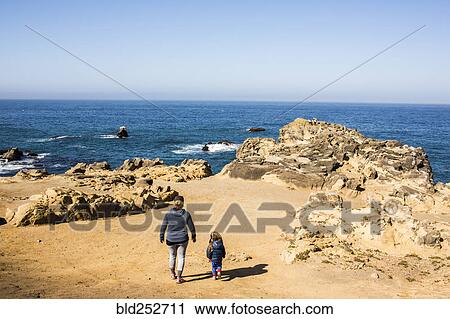 Caucasian mother and daughter walking near ocean View Large Photo Image Stock Image - Caucasian mother and daughter walking near ocean. Fotosearch