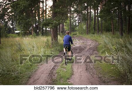 Caucasian teenage boys riding bicycle in woods View Large Photo Image Stock Photograph - Caucasian teenage boys riding bicycle in woods. Fotosearch