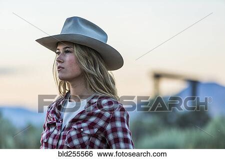 Stock Photograph - Caucasian teenage girl wearing cowboy hat. Fotosearch