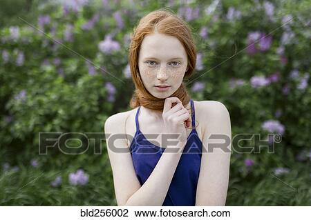 Caucasian teenage girl wrapping hair around neck View Large Photo Image Stock Image - Caucasian teenage girl wrapping hair around neck. Fotosearch