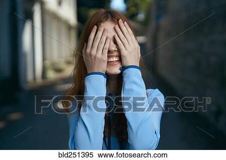 Caucasian woman covering eyes with hands View Large Photo Image Stock Photography - Caucasian woman covering eyes with hands. Fotosearch