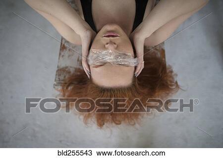 Caucasian woman covering eyes with plastic View Large Photo Image Stock Image - Caucasian woman covering eyes with plastic. Fotosearch