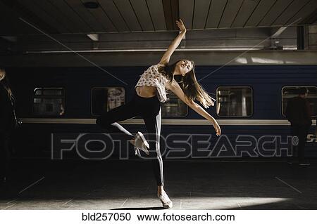 Caucasian woman dancing near train View Large Photo Image Stock Image - Caucasian woman dancing near train. Fotosearch