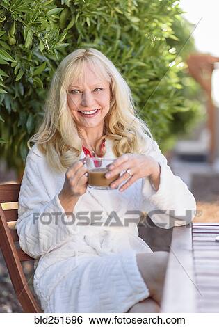 Stock Photograph - Caucasian woman drinking coffee. Fotosearch