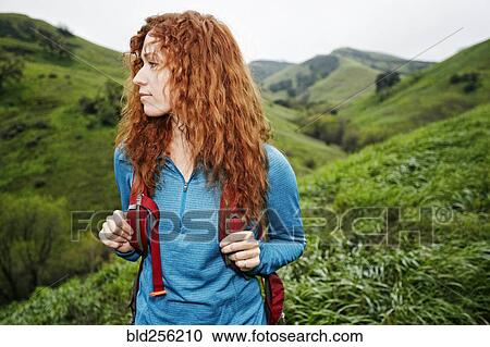 Caucasian woman hiking with backpack View Large Photo Image Stock Image - Caucasian woman hiking with backpack. Fotosearch