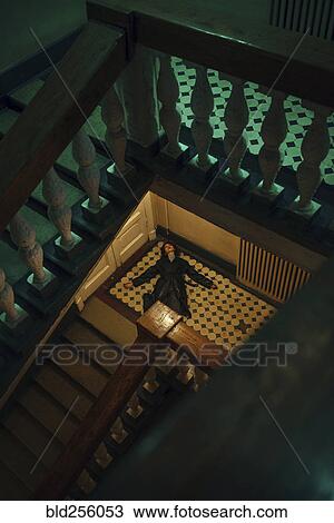 Caucasian woman laying on staircase View Large Photo Image Stock Image - Caucasian woman laying on staircase. Fotosearch