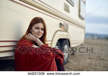 Caucasian woman leaning on motor home View Large Photo Image Stock Photo - Caucasian woman leaning on motor home. Fotosearch