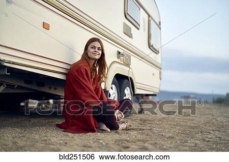 Caucasian woman leaning on motor home View Large Photo Image Stock Photograph - Caucasian woman leaning on motor home. Fotosearch