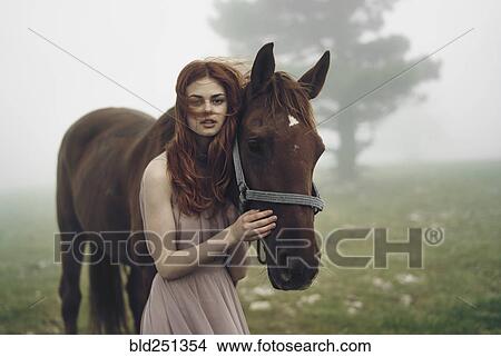 Caucasian woman petting horse View Large Photo Image Picture - Caucasian woman petting horse. Fotosearch