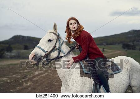 Caucasian woman riding horse View Large Photo Image Stock Image - Caucasian woman riding horse. Fotosearch