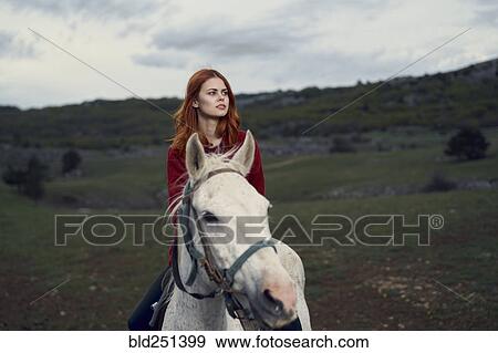 Caucasian woman riding horse View Large Photo Image Stock Photo - Caucasian woman riding horse. Fotosearch