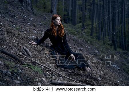 Caucasian woman sitting on hill View Large Photo Image Stock Image - Caucasian woman sitting on hill. Fotosearch