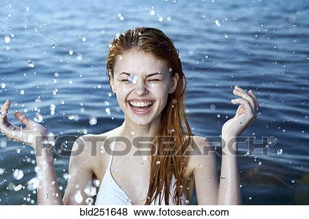 Caucasian woman splashing in ocean View Large Photo Image Stock Photo - Caucasian woman splashing in ocean. Fotosearch