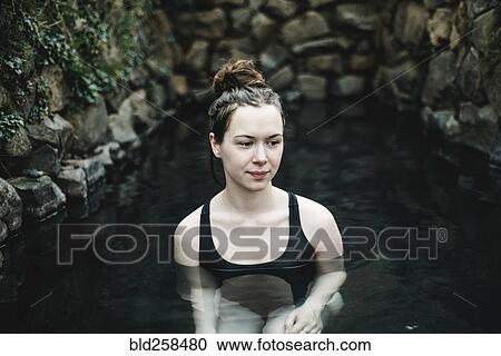 Caucasian woman swimming in pond View Large Photo Image Stock Image - Caucasian woman swimming in pond. Fotosearch