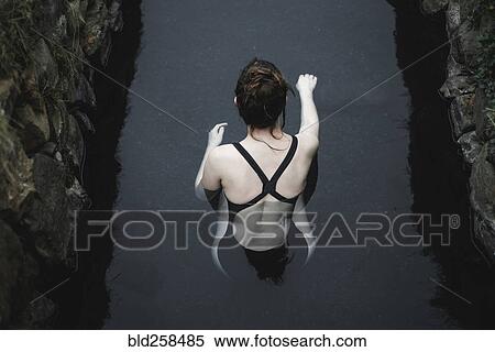 Caucasian woman swimming in pond View Large Photo Image Stock Photography - Caucasian woman swimming in pond. Fotosearch