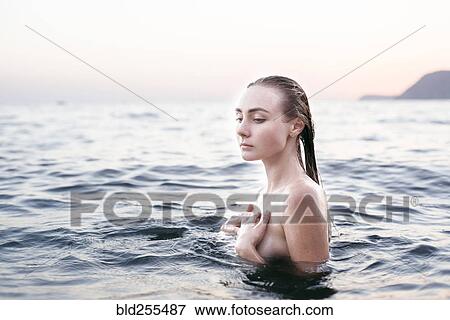 Stock Photo - Caucasian woman swimming. Fotosearch