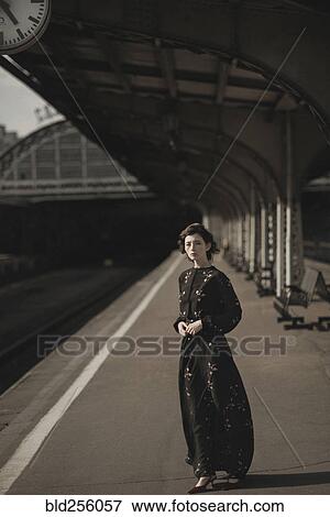 Caucasian woman waiting at train station View Large Photo Image Stock Photo - Caucasian woman waiting at train station. Fotosearch