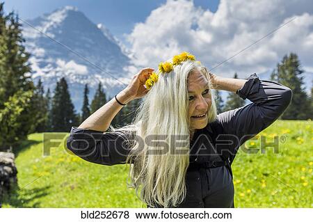Stock Photo - Caucasian woman wearing crown of flowers. Fotosearch