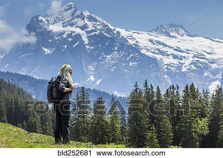 Caucasian woman wearing crown of flowers admiring scenic view of mountain View Large Photo Image Stock Image - Caucasian woman wearing crown of flowers admiring scenic view of mountain. Fotosearch