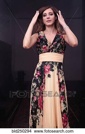 Picture - Caucasian woman wearing floral dress. Fotosearch