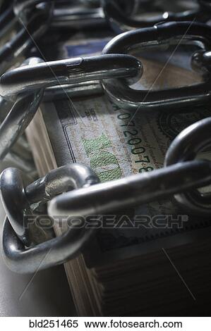 Chains on stack of money View Large Photo Image Stock Photography - Chains on stack of money. Fotosearch