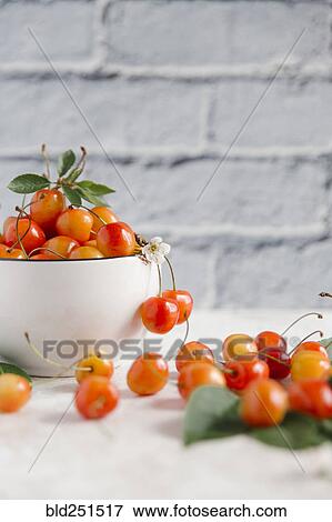 Stock Photo - Cherries on white wooden table. Fotosearch