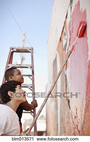 Children painting wall View Large Photo Image Stock Image - Children painting wall. Fotosearch