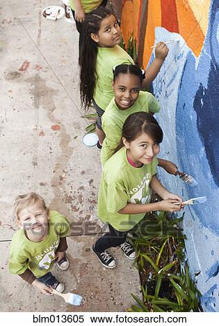 Stock Photography - Children painting wall. Fotosearch