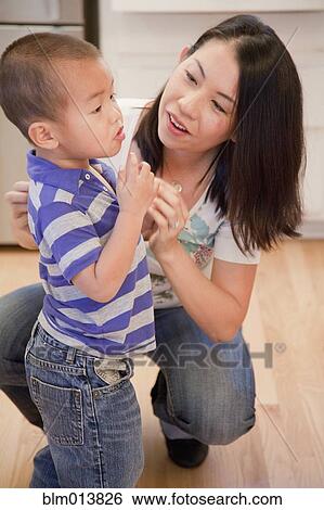 Chinese mother talking to son View Large Photo Image Stock Photograph - Chinese mother talking to son. Fotosearch