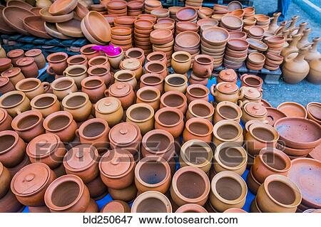 Clay pots and bowls on floor View Large Photo Image Stock Photo - Clay pots and bowls on floor. Fotosearch