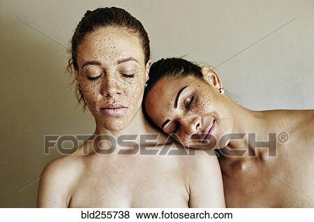 Stock Photo - Close up of affectionate mixed race women. Fotosearch