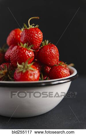 Stock Photo - Close up of bowl of strawberries. Fotosearch