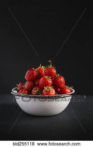 Stock Photo - Close up of bowl of strawberries. Fotosearch