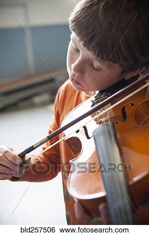 Close up of Caucasian boy 1acticing violin View Large Photo Image Stock Photograph - Close up of Caucasian boy 1acticing violin. Fotosearch