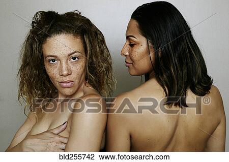 Stock Image - Close up of confident mixed race women. Fotosearch