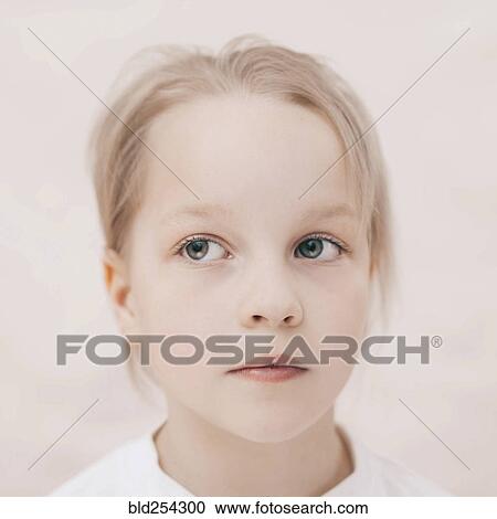 Stock Image - Close up of curious Caucasian girl. Fotosearch