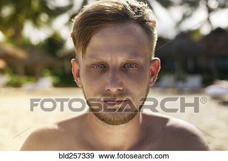 Close up of face of serious Caucasian man View Large Photo Image Stock Photo - Close up of face of serious Caucasian man. Fotosearch