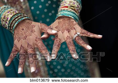 Stock Photo - Close up of henna on Indian woman's hands. Fotosearch