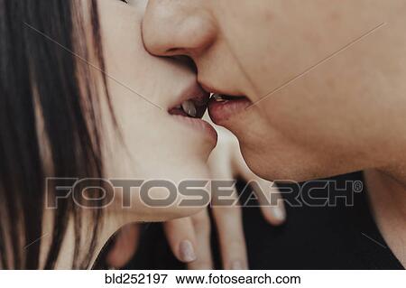 Stock Photo - Close up of Middle Eastern couple kissing. Fotosearch