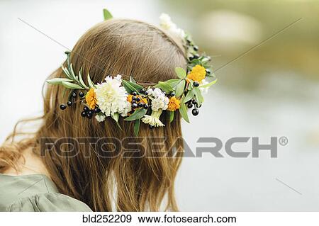 Stock Photo - Close up of Middle Eastern woman wearing flower crown. Fotosearch