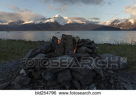 Stock Photograph - Close up of rocks surrounding campfire. Fotosearch