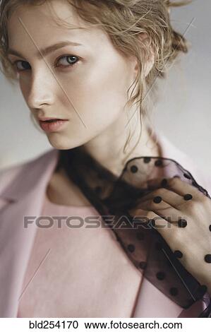 Stock Image - Close up of serious Caucasian woman. Fotosearch