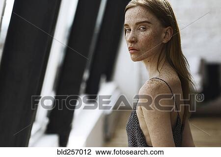 Close up of serious Caucasian woman with freckles View Large Photo Image Stock Image - Close up of serious Caucasian woman with freckles. Fotosearch