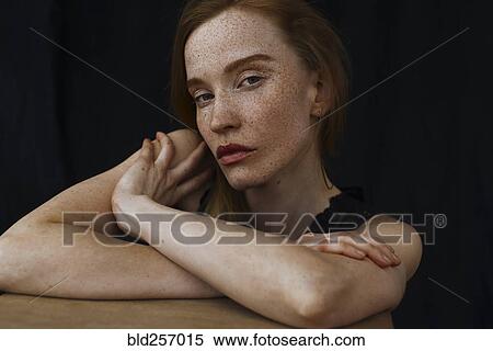 Stock Photography - Close up of serious Caucasian woman with freckles. Fotosearch