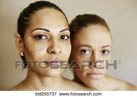 Stock Photo - Close up of serious mixed race women. Fotosearch