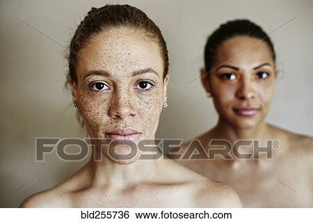Close up of serious mixed race women View Large Photo Image Stock Photograph - Close up of serious mixed race women. Fotosearch