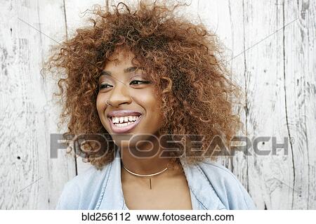 Stock Image - Close up of smiling black woman. Fotosearch