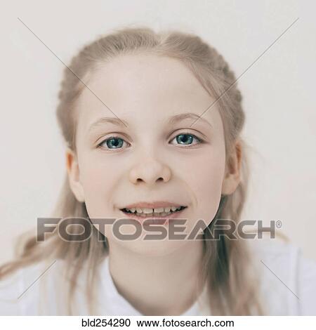 Stock Image - Close up of smiling Caucasian girl. Fotosearch