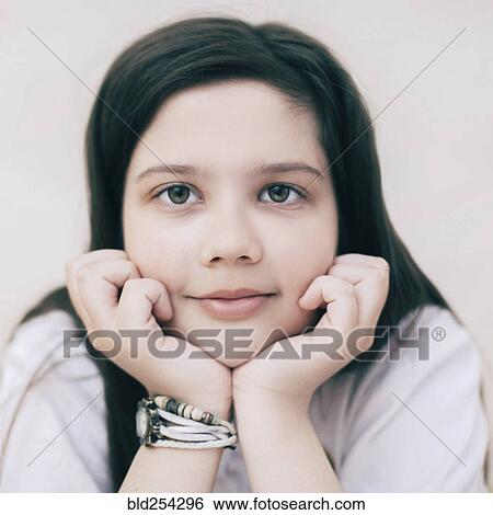 Stock Photograph - Close up of smiling Caucasian girl. Fotosearch