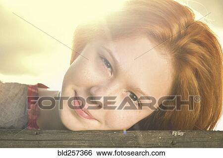 Stock Photograph - Close up of smiling Caucasian teenage girl. Fotosearch